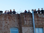 People watch Local Natives from the rooftop of the neighboring apartment building. Photo by Bronson