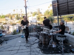 Local Natives perform on the rooftop of their Silver Lake practice space, July 7, 2016. Photo by Bronson