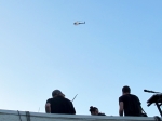 An LAPD helicopter buzzes the Local Natives' rooftop show. Photo by Bronson