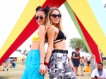 Friends pose with the SUPERNOVA art installation at Coachella (Photo by Rich Fury, courtesy of Getty Images for Coachella)