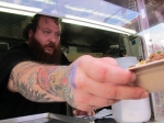 Action Bronson serving his poutine at SXSW (Photo by Kevin Bronson)